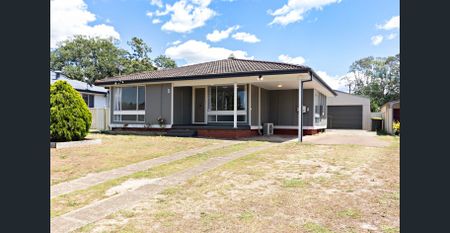 FRESHLY UPDATED FAMILY HOME WITH SOLAR & AIR-CON - Photo 2