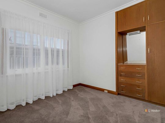 Family Home with Compact Yard - Photo 1