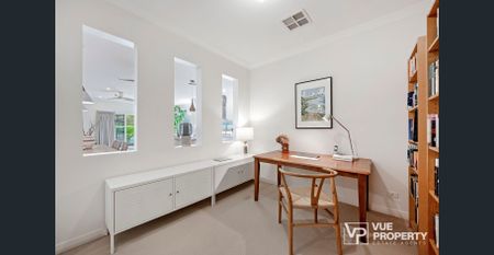 Where modern design meets peaceful living in a single-level family home - Photo 5