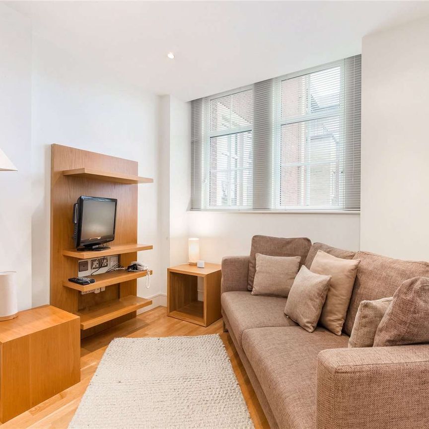 Well presented two bedroom apartment, in a highly regarded building with 24 hr concierge service, a residents' gym and garaged parking for 1 car. - Photo 1