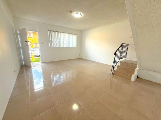 RENOVATED TOWNHOUSE - Photo 1