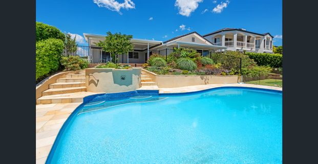 MODERN WATERFRONT ENTERTAINER WITH SKYLINE VIEWS IN BENOWA WATERS - Photo 1