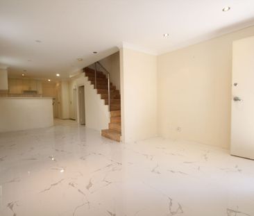 Spacious Three-Storey Townhouse in Prime Location - Photo 1