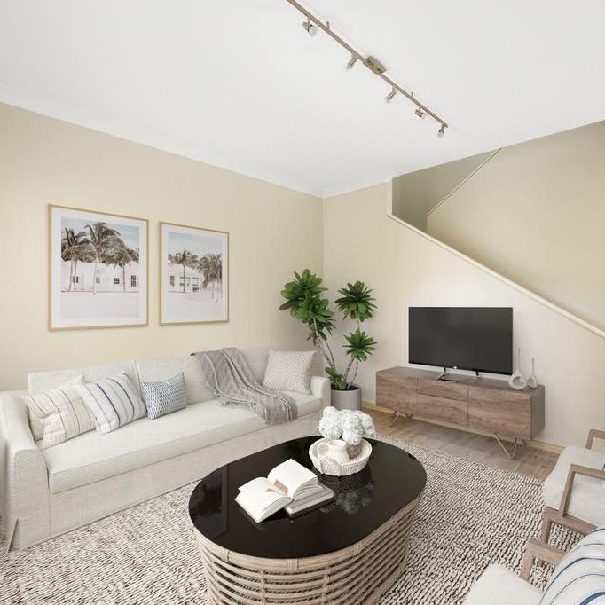 Spacious 3-Bedroom Townhouse in a Great Location with Pool Access - Photo 1