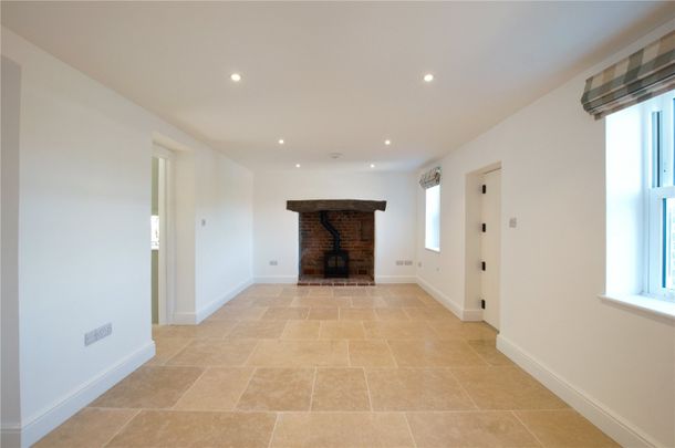 A beautifully refurbished brick and flint cottage combining charming period character with stylish, high-quality finishes throughout. - Photo 1