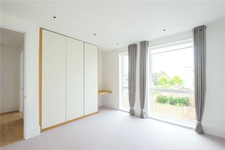 A wonderful first floor, contemporary two bedroom, two bathroom, apartment with in excess of 1100 of accommodation, situated on the upper Lansdown slopes just a mile north of Bath City Centre with south facing views from the balcony, and off-street parking space. - Photo 2