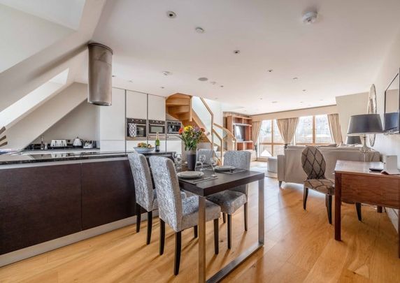 Elevate your lifestyle in this unique residence where modern sophistication meets historic charm. - Photo 1