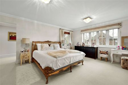 Set within a prestigious private estate, this impressive six bedroom residence offers generous and versatile accommodation perfectly designed for modern family living. - Photo 5