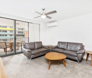 FURNISHED CITY ESCAPE WITH GENEROUS ENTERTAINER'S BALCONY - Photo 2