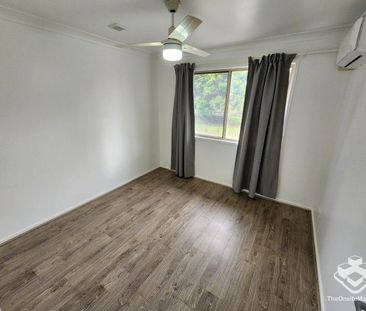 Double Garage, Air-Conditioned and wooden flooring throughout! - Photo 5