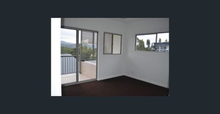 Elevated unit two bedrooms and two bathrooms undercover parking close to school, transport and shops - Photo 2