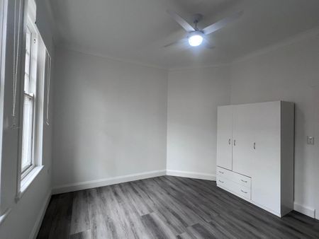 Spacious 3-Bedroom Home with Sunroom and Garden Shed - Photo 2