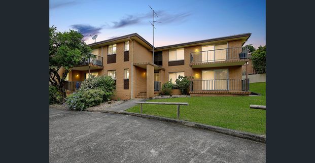 Centrally Located Two Bedroom Unit with Carport - Photo 1
