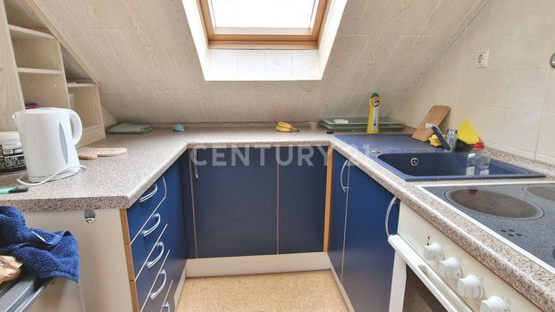 Gemütliche Dachgeschosswohnung mit Einbauküche - Foto 1