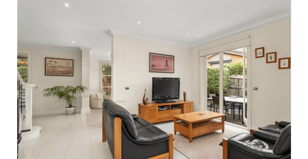 Modern Family Haven with Dual Living Zones and Ground-Floor Master Suite - Photo 5