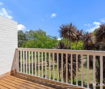 Stylish 3-Bedroom Townhouse with Golf Course Views & EV Charging - Photo 1