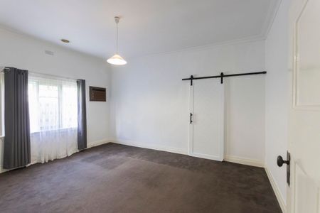 This beautifully presented, spacious three-bedroom home is ideally positioned in a highly sought-after location. - Photo 3