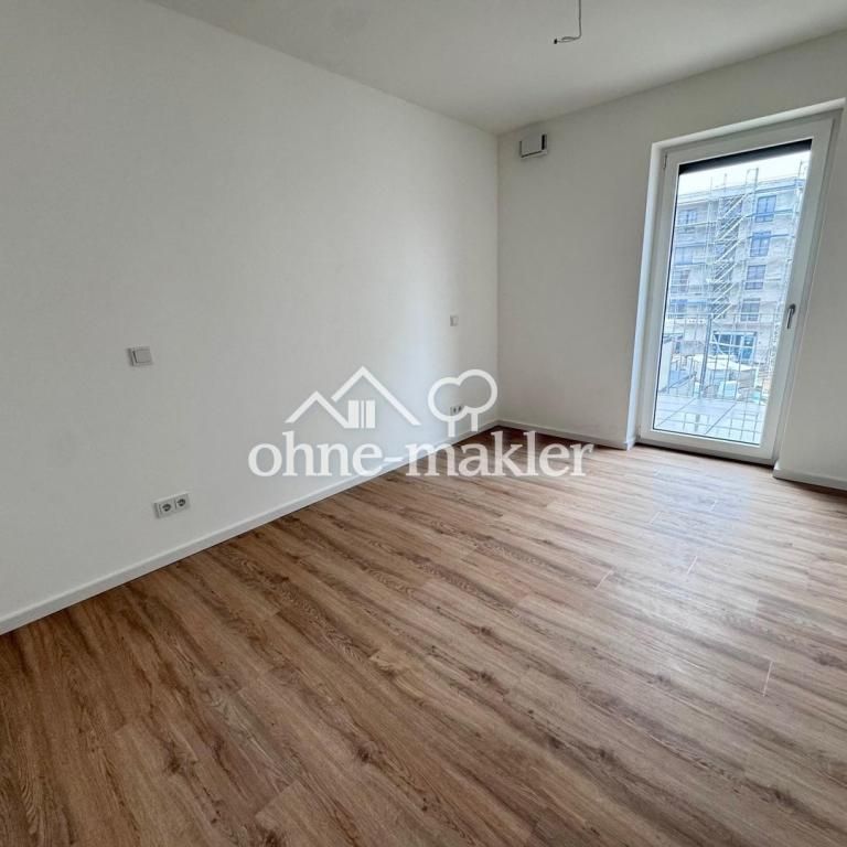 Lichtdurchflutete 2-Zimmer Wohnung mit Einbauküche und Balkon! NEUBAU - Photo 1