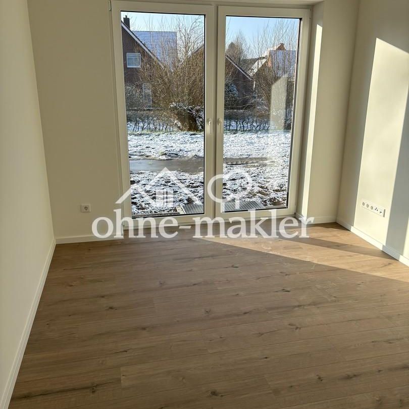 Exklusive Neubauwohnung im Erdgeschoss mit Garten - Foto 1