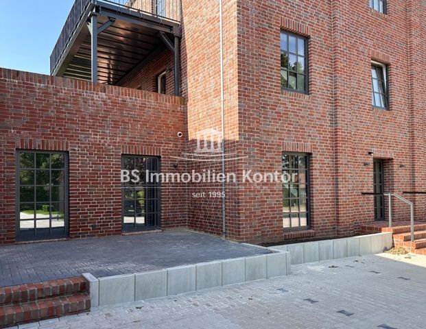 Erstbezug! Wohnung im EG mit Einbauküche, Terrasse und Stellplätzen in zentraler Lage! - Foto 1