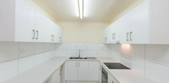 Neat & Spacious Unit with Easy-Care Living - Photo 2