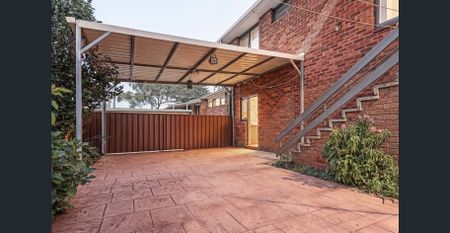 Expansive Full Brick Townhouse | Spacious Living | Prime Location - Photo 2