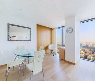 A bright 2 bedroom apartment situated on the 19th floor of this prestigious dockside development located close to the heart of Canary Wharf's business district. - Photo 1