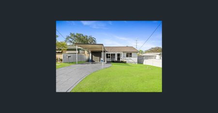Family home with multiple living zones and large fenced yard - Photo 4