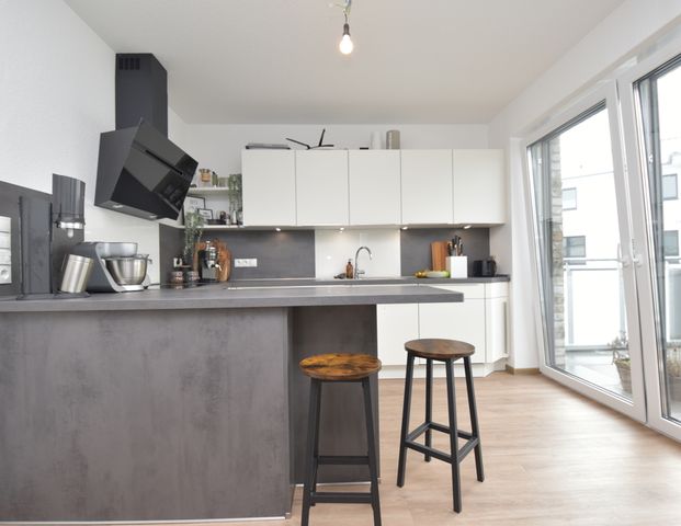 Energieeffizient und modern wohnen - Mietwohnung mit Einbauküche, Balkon und Carport in Friesoythe - Photo 1