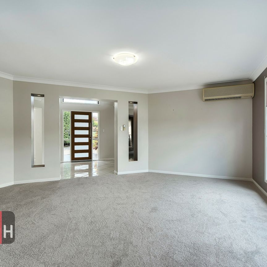 SPACIOUS, EXECUTIVE-STYLE HOME IN BRIDGEMAN DOWNS - Photo 1