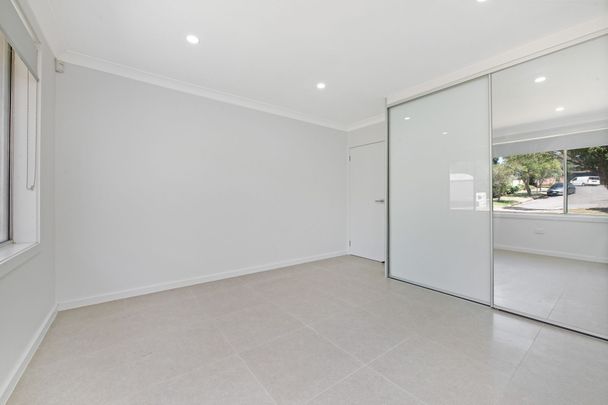 TASTEFULLY RENOVATED HOME WITH AMPLE PARKING AND STORAGE - Photo 1