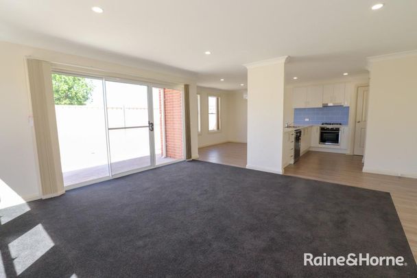 Two Bedroom Townhouse Close to CBD- Available 12.1.2026 - Photo 1