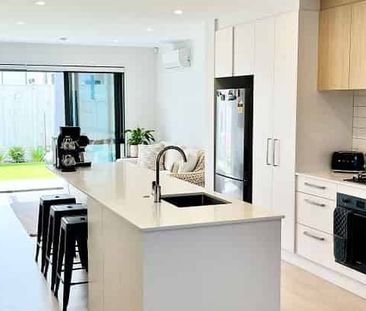 Modern 3-Bedroom Home in Sought-After Waiata Shore - Photo 5