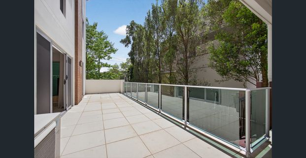 2 Bedroom Unit with Extra Sunroom, Large Balcony and Huge Grassed Backyard - Photo 1