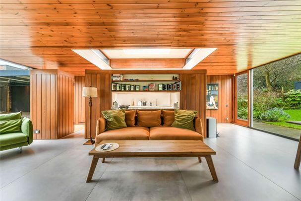 Nestled within a prestigious secluded private road in Blackheath, this striking family home stands as a testament to contemporary luxury and sustainability. Spanning 1197 square feet. - Photo 1