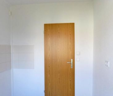 Bequem im Erdgeschoss mit Südbalkon! - Photo 1