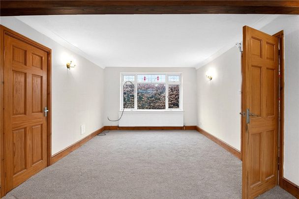 A four bedroom detached family home with a gated driveway in Marston. - Photo 1