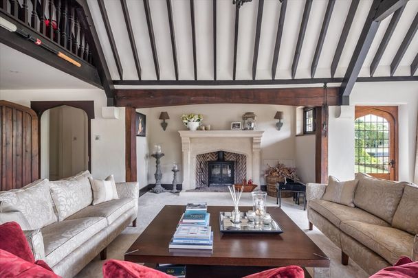 A superb countryside home with spectacular views, a tennis court, swimming pool, putting green & stables situated close to Guildford Town, available to let. - Photo 1