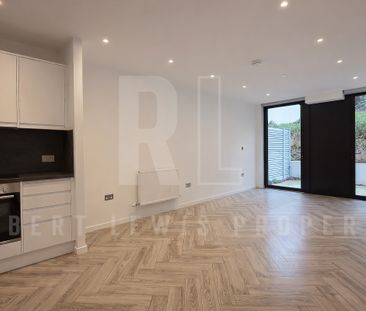 Stylish Ground Floor Apartment with Private Patio & Residents’ Gym ... - Photo 2