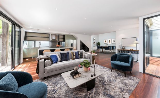 SPACIOUS FAMILY LIVING IN A QUIET TREE-LINED POCKET - Photo 1