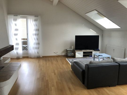 Generous penthouse apartment with balcony! 1st month FREE! - Photo 1