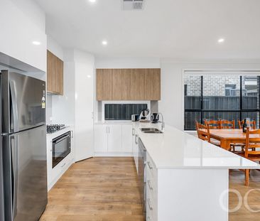 Open the Door to Sun-Soaked Living in a Premium Woodville West Pocket - Photo 2