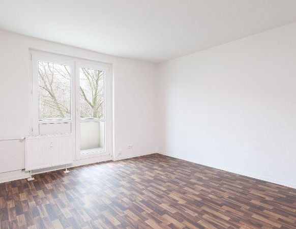 Familienfreundliche 4 Zimmer-Wohnung im 1. Obergeschoss mit Balkon - Foto 1
