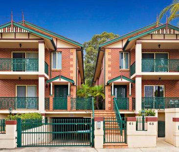 Spacious Two-Storey Townhouse in a Serene Locale - Photo 1