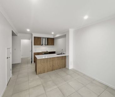 MODERN, SPACIOUS & LOW MAINTENANCE LIVING IN THE HEART OF AURA! - Photo 6