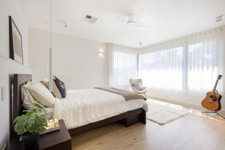 Stylish modern home featuring five bedrooms across two levels - Photo 2