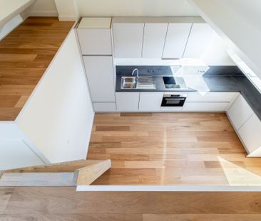 Dit appartement met mezzanine en 1 slaapkamer is gelegen op de bove... - Photo 2