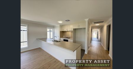 Beautiful Brand-New Family Home with Solar & Second Living Area - Photo 4