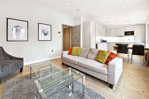 This is a very impressive modern Westminster development set in a discreet gated mews. The property comprises: 2 bedrooms, 2 bathrooms, reception, open plan kitchen, garaged parking. - Photo 1