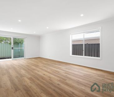 Spacious 4-Bedroom Family Home with Modern Comforts - Photo 1